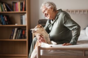 Senior woman enjoying time with her little dog.